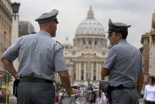 Italian police officers exchange a few words in front of St Peter's square at the Vatican. Photo / AP